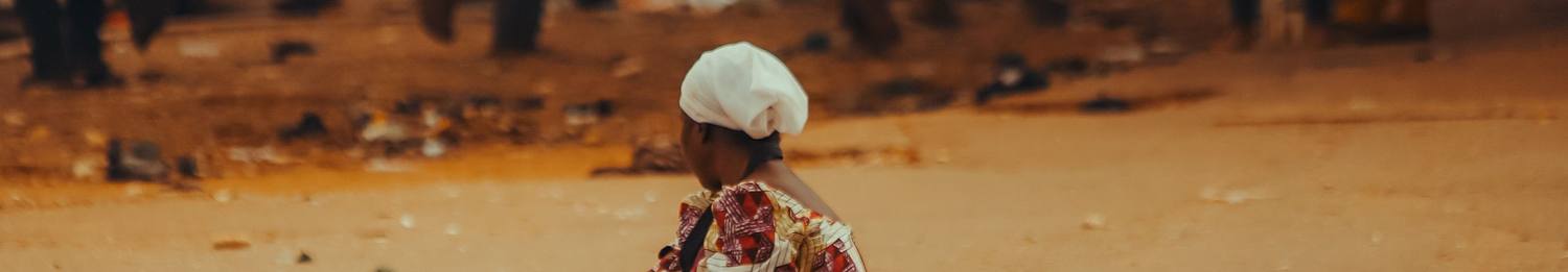 A trader at a roadside market stall