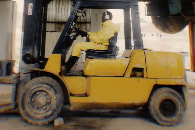 A forklift truck working in a yard